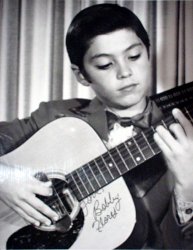 A young Bobby playing guitar